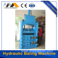 Hydraulic baling machine with pressure